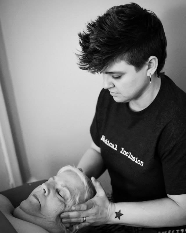Photograph of a younger Frances Reed giving a client a jaw massage